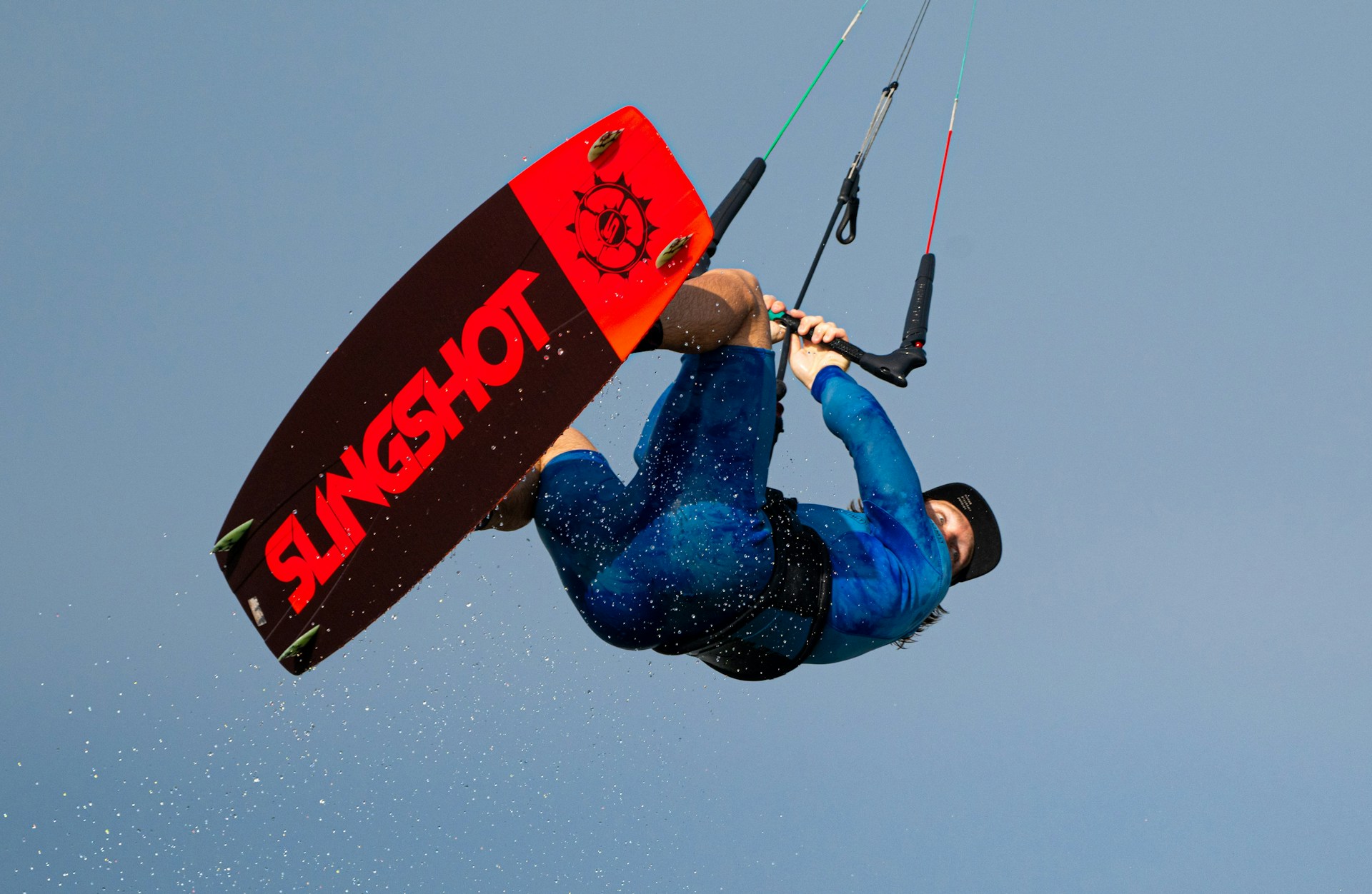Kitesurfer jumping above the sea