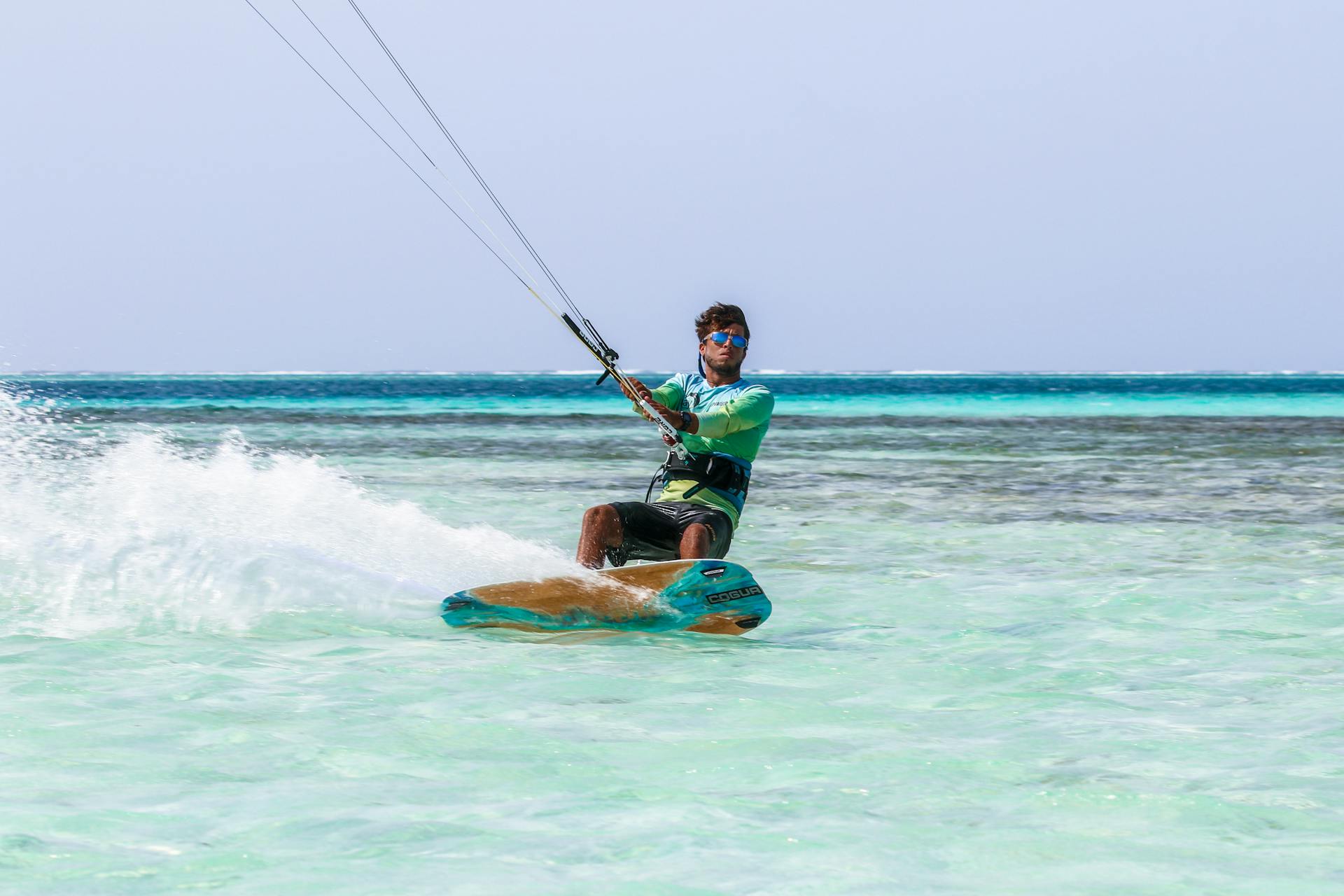 Kitesurfer cruising in turquoise water